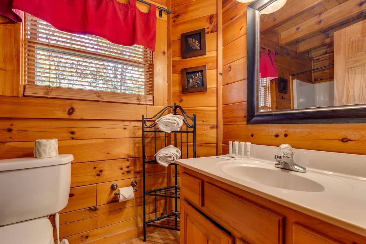 Covered upper deck with rocking chairs, mountain views, and golden autumn light