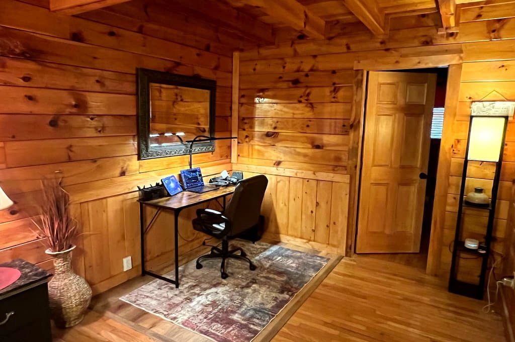 Wooden work desk and office chair in a cabin room