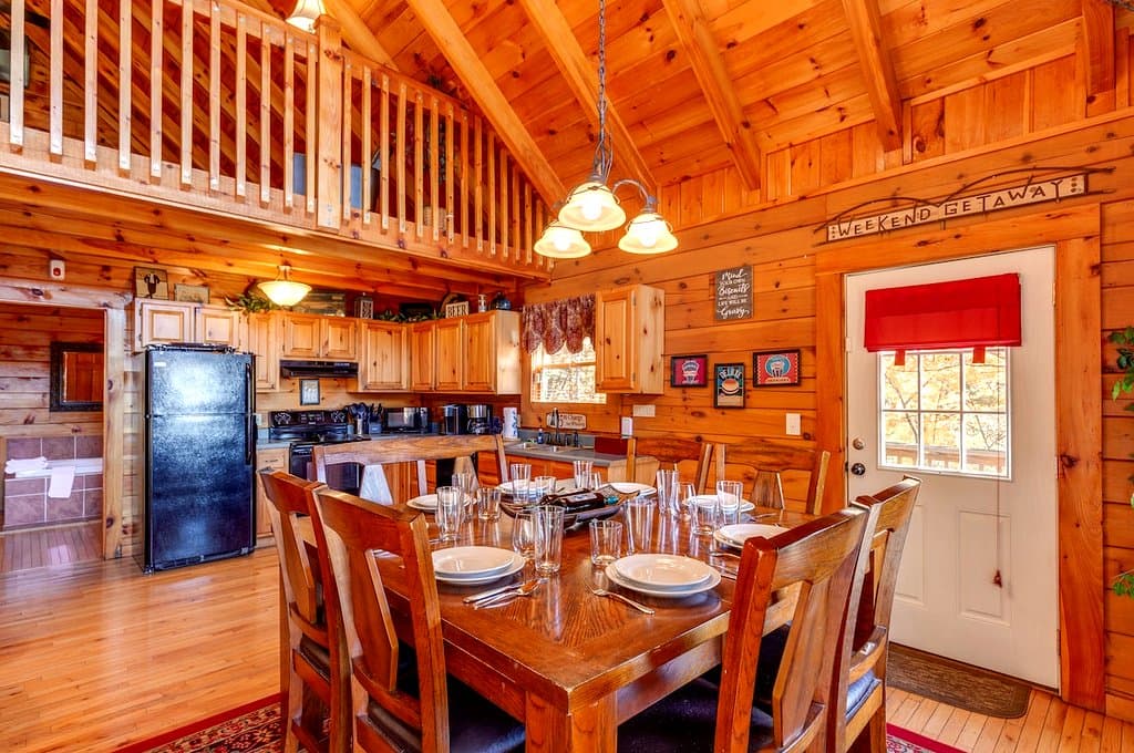 Kitchen and dining table beneath the cabin loft