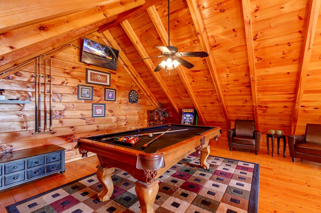 Actual photo from Thistle Britches: Loft game room with a pool table, arcade cabinet and dartboard